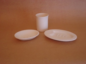 Toothbrush holder with soap dishes